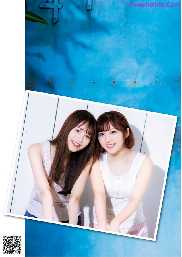 A couple of young women posing for a picture together.
